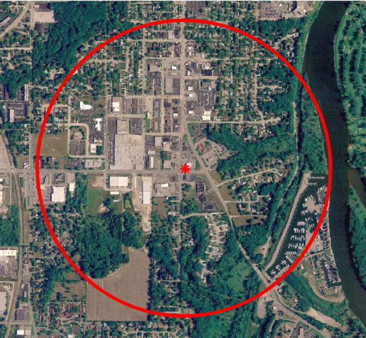 An areal view of an area with a red circle drawn on it